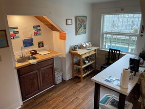 Full-sized fridge, microwave, toaster, cleaning supplies