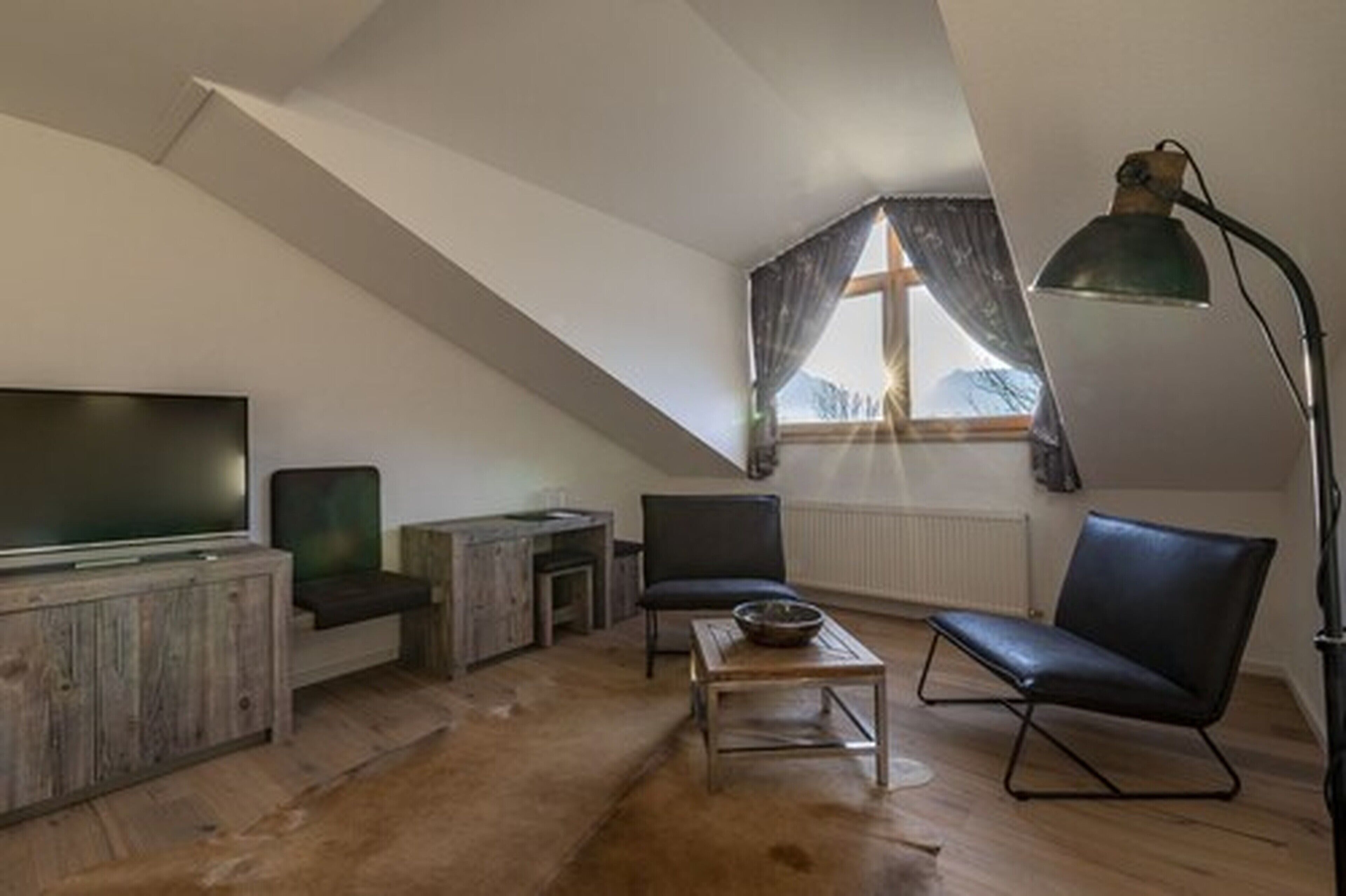 comfort double room | living area | flat-screen tv