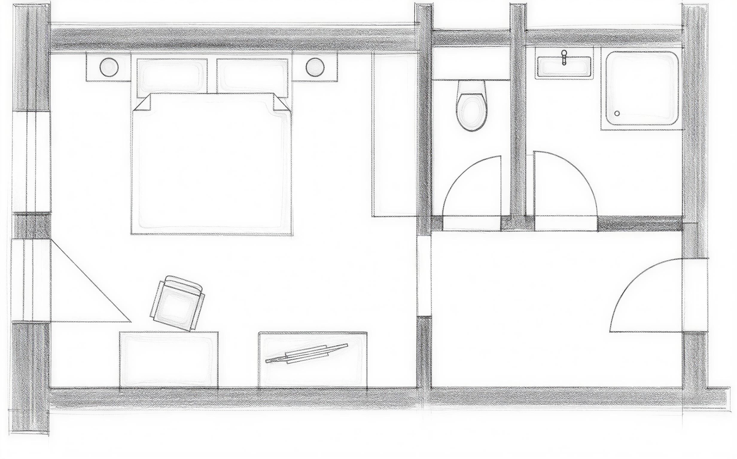 A floor plan of a hotel room with a bed, a desk, a chair, a small table, a sink, and a toilet.