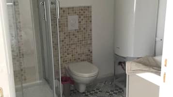 Shower, towels, soap, toilet paper