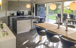 Fridge, stovetop, dishwasher, coffee/tea maker