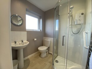 Bathtub, hair dryer, towels, soap