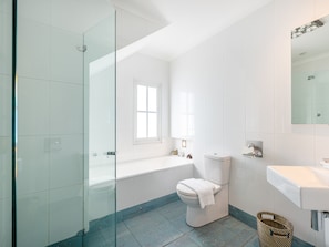 Bathtub, hair dryer, soap, shampoo