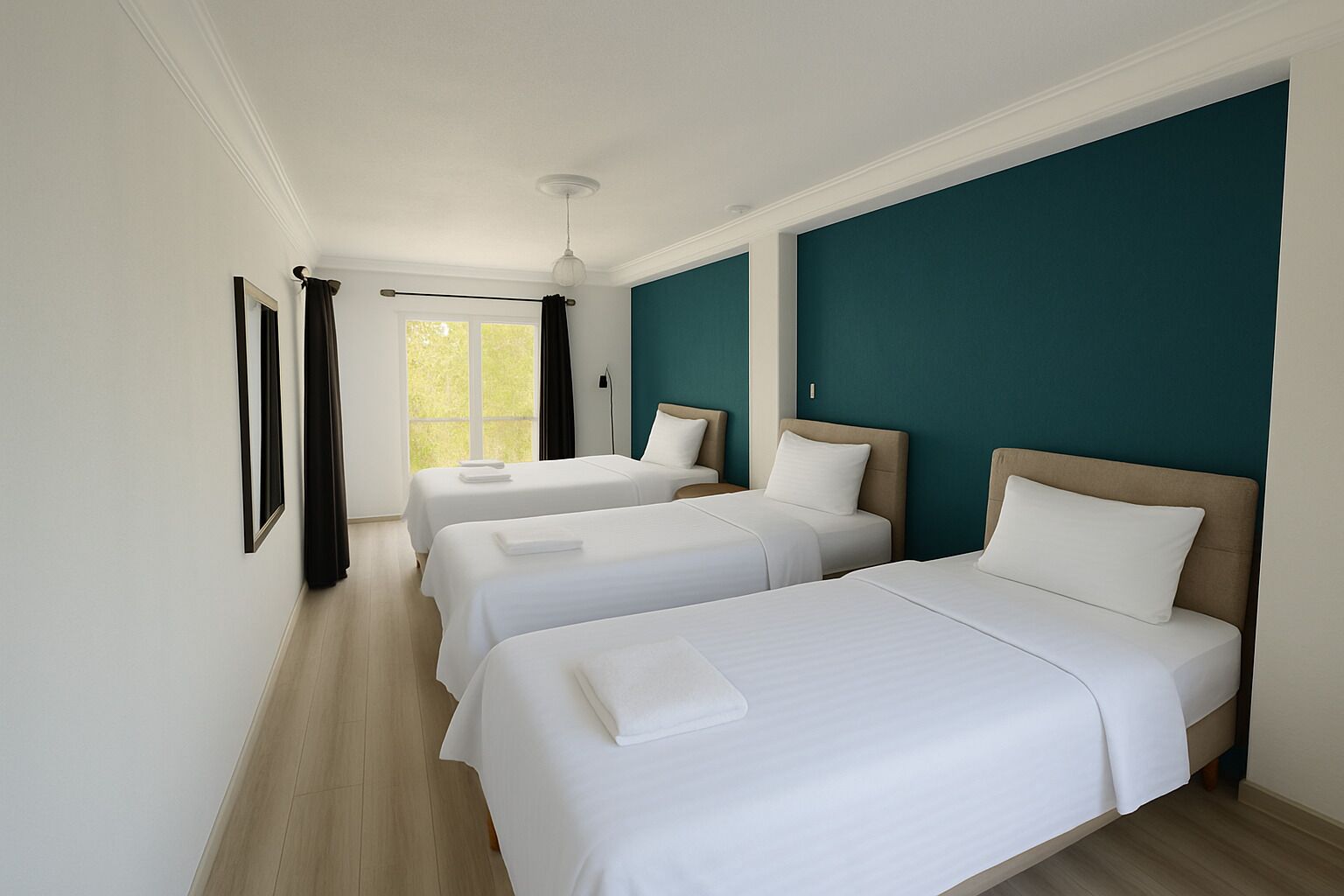 A hotel room with two beds, a large window, and a view of greenery outside.