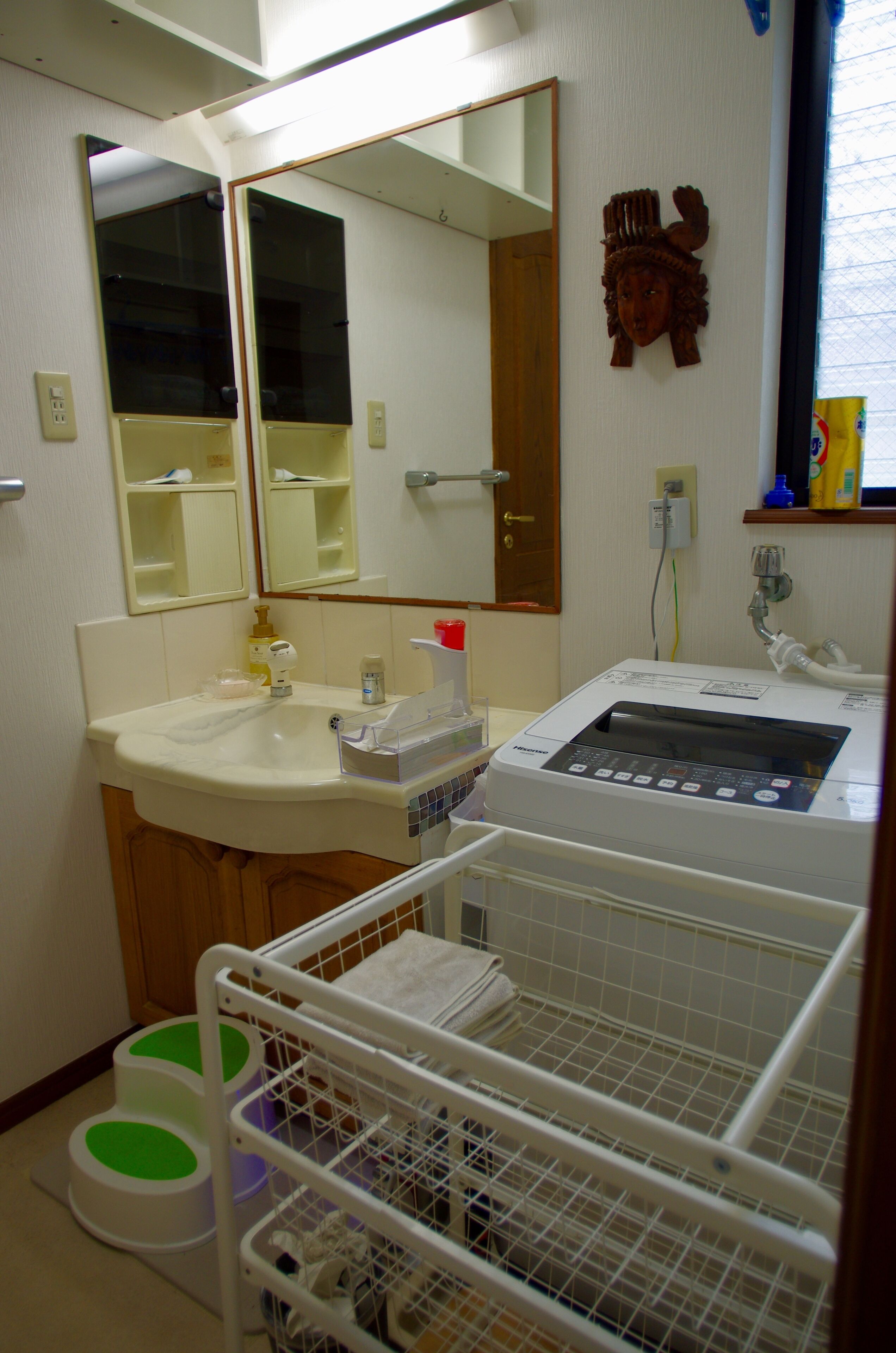 A bathroom with a sink, mirror, and a medical device.
