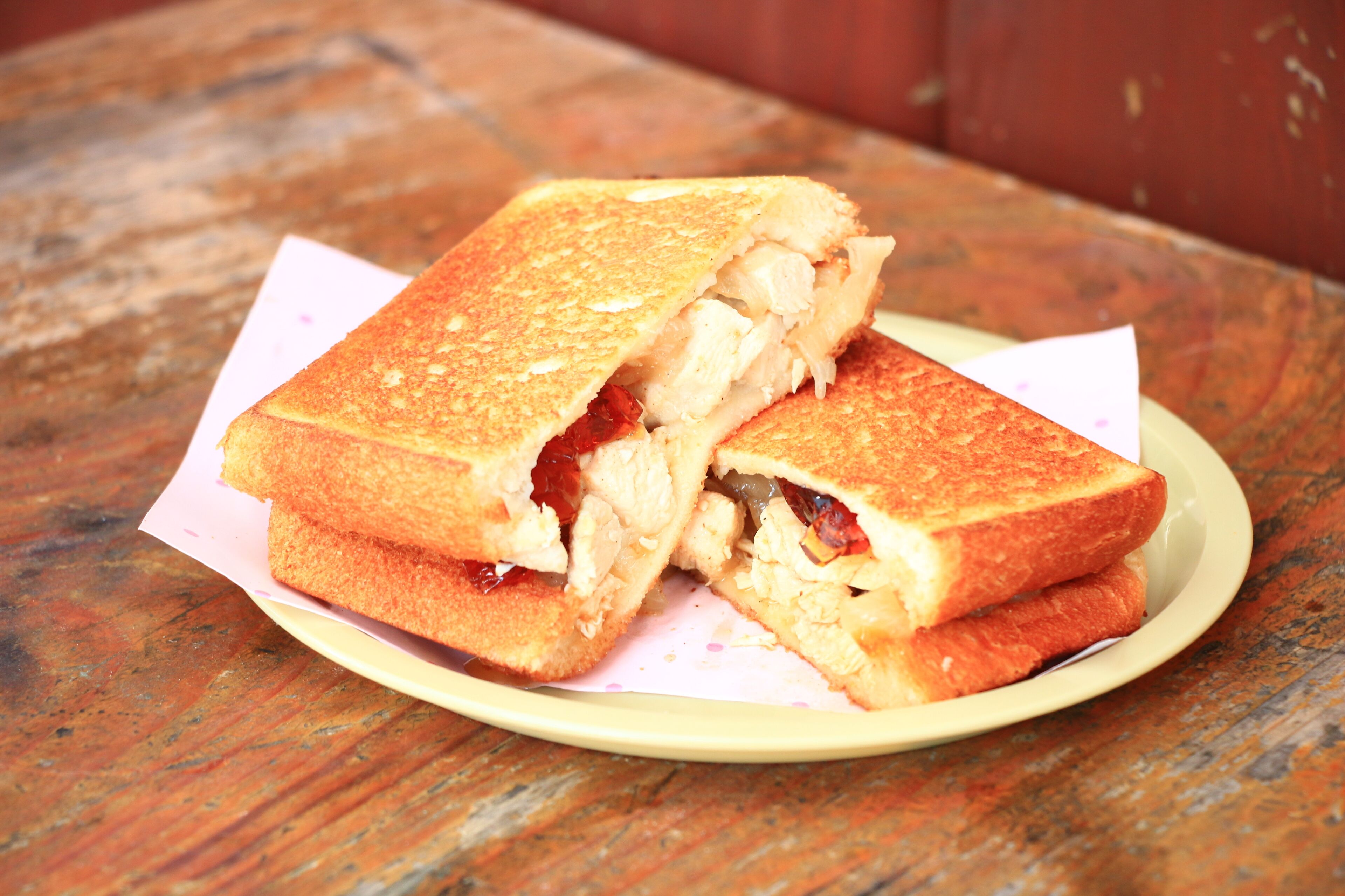 A grilled sandwich on a plate.