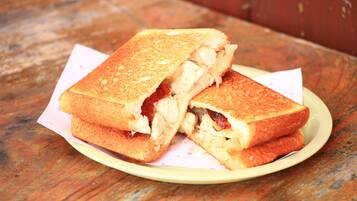 A grilled sandwich on a plate.