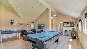 A spacious room with a pool table, a foosball table, and a bar area. - Lovely home in Nørre Nebel with sauna (Nørre Nebel)