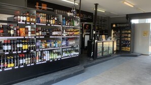 A liquor store with shelves stocked with various bottles of alcohol. - Biloela Hotel (Biloela)