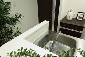 Comfort Room | Private kitchen | Fridge, microwave, stovetop - The Grand Residence Hotel Hakata (Fukuoka)