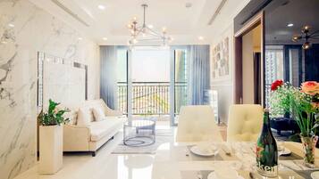 Apartment, 4 Bedrooms, River View | Living area | 50-inch flat-screen TV with cable channels, Smart TV, Netflix