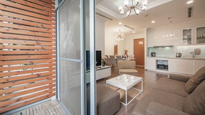 Apartment, 1 Bedroom, City View | Living area | 50-inch flat-screen TV with cable channels, Smart TV, Netflix