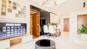 Apartment, 4 Bedrooms, River View | Living area | 50-inch flat-screen TV with cable channels, Smart TV, Netflix