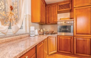 Fridge, stovetop, dishwasher, coffee/tea maker