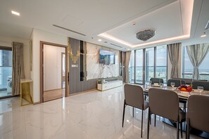 Premium Penthouse | Living area | 65-inch flat-screen TV with digital channels, TV, Netflix - THE LANDMARK 81 CONDOTEL SUITE IN HCMC (Ho Chi Minh City)