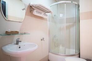 Shower, rainfall showerhead, slippers, towels