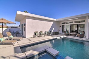 A heated pool, pool loungers