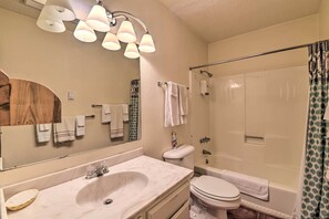 A bathroom with a sink, mirror, toilet, and shower. - Angel Fire Mtn Escape: Walk to Chile Express Lift! (Angel Fire)