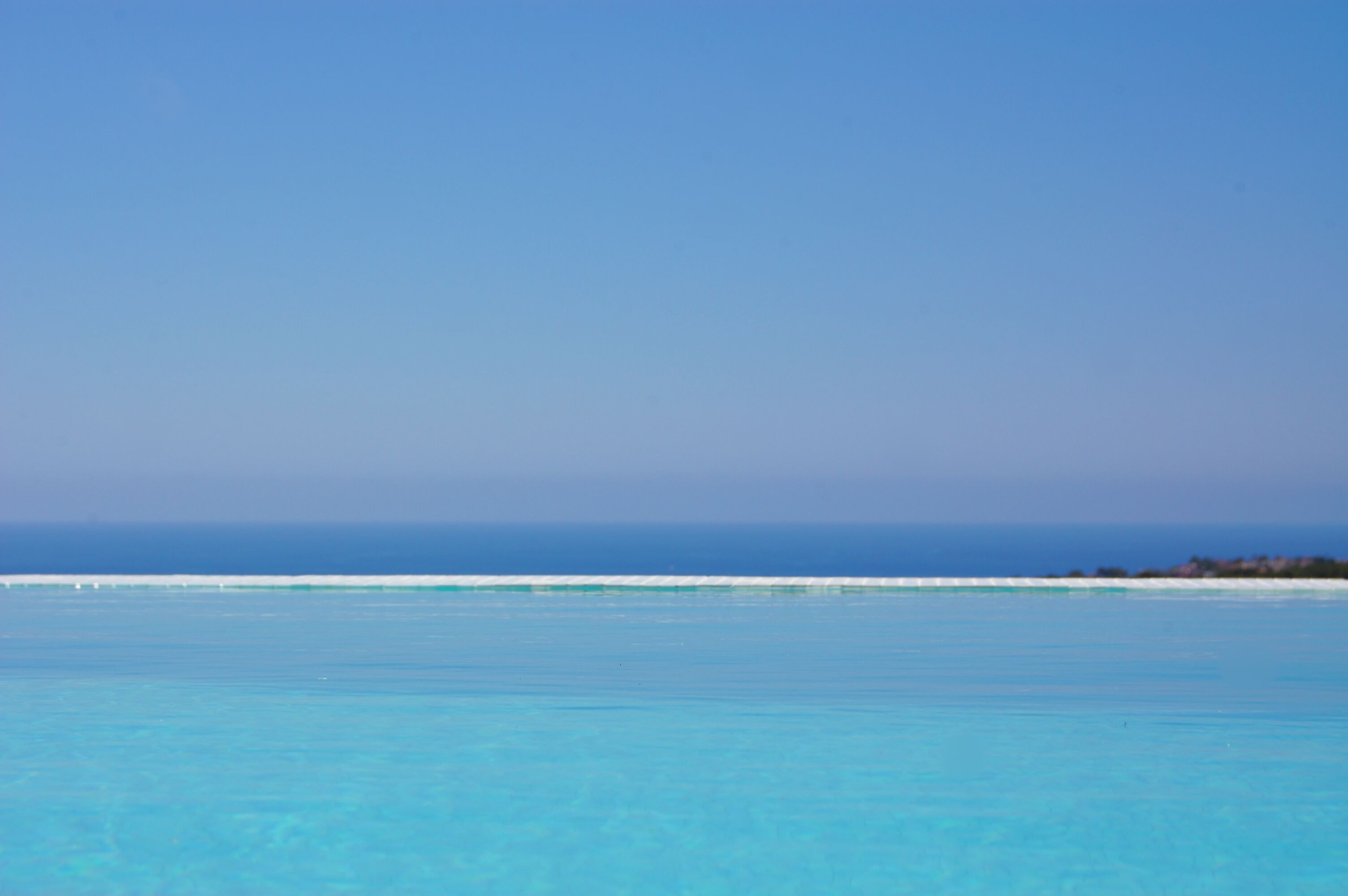 Outdoor pool, an infinity pool, sun loungers