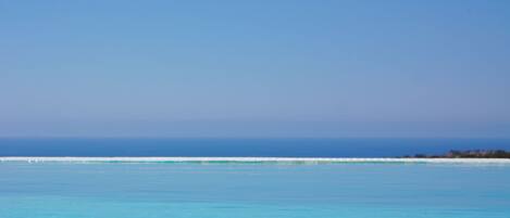 Outdoor pool, an infinity pool, sun loungers