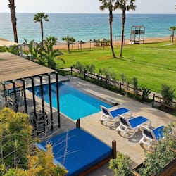 Seasonal outdoor pool, open 7:00 AM to 10:00 PM, pool umbrellas