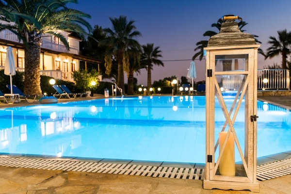 Seasonal outdoor pool, open 9:00 AM to 7:00 PM, sun loungers