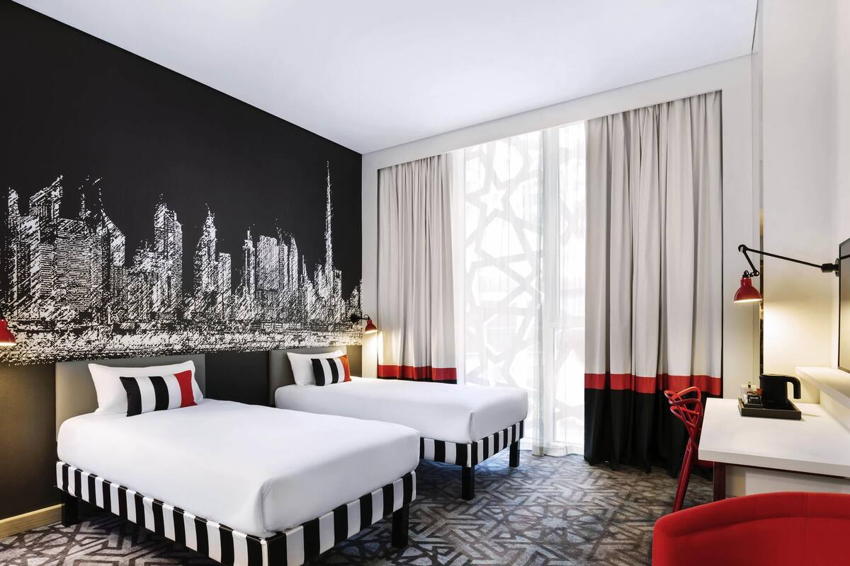 standard room, 2 twin beds with free airport transfer & shuttle to la mer & malls | in-room safe, individually decorated, desk, laptop workspace