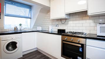 Apartment | Private kitchen | Full-size fridge, microwave, oven, stovetop