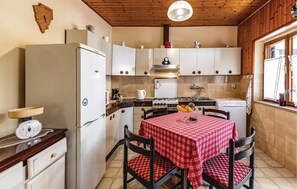 Fridge, stovetop, dishwasher, coffee/tea maker