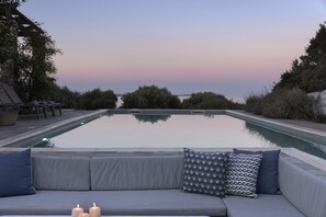 Seasonal outdoor pool, pool loungers