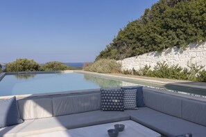 Seasonal outdoor pool, pool loungers