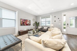 Flat-screen TV, fireplace, video game console, ping pong