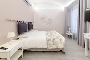 Premium bedding, down comforters, in-room safe, desk