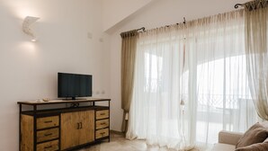Apartment, 2 Bedrooms (Cozy Sherden) | Television - Villaggio Sherden (Golfo Aranci)