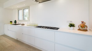 Villa, 3 Bedrooms (Villetta Cala Sassari) | Private kitchen | Full-size fridge, oven, stovetop, dishwasher - Cala Sassari (Golfo Aranci)