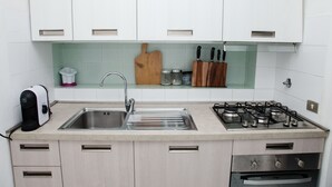 Apartment, 1 Bedroom | Private kitchen | Coffee/tea maker, fridge, oven, stovetop - Punta Bados (Golfo Aranci)