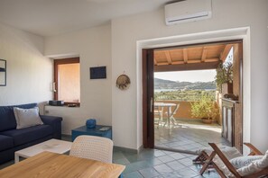 Apartment, 1 Bedroom, Mezzanine | Living area | Flat-screen TV - Borgo Marana (Golfo Aranci)