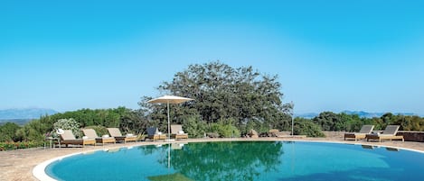 Outdoor pool, open 7:30 AM to 9:00 PM, pool umbrellas, pool loungers