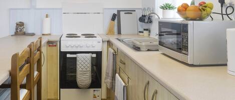 Fridge, microwave, cookware/dishes/utensils