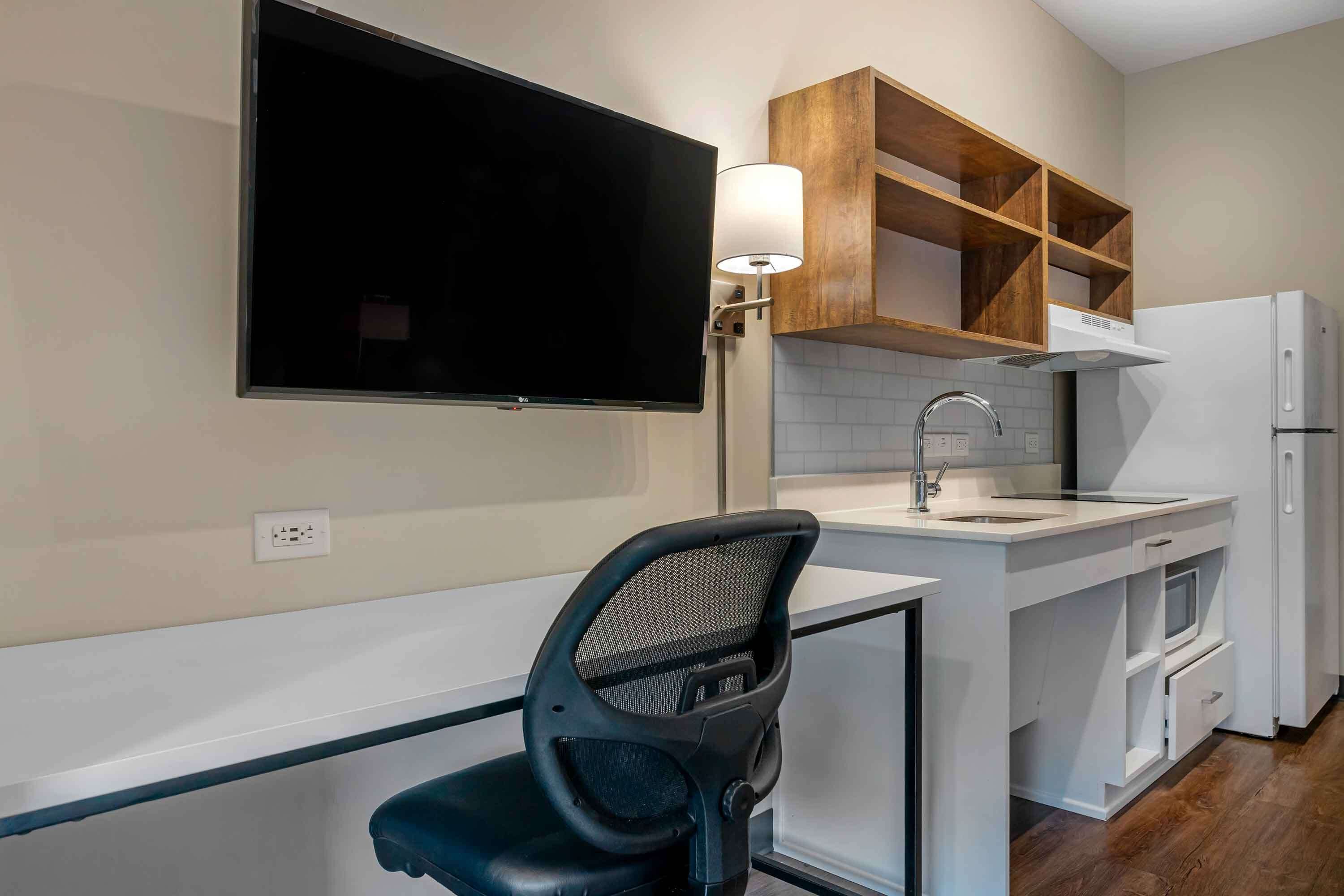 premium bedding, desk, laptop workspace, iron/ironing board