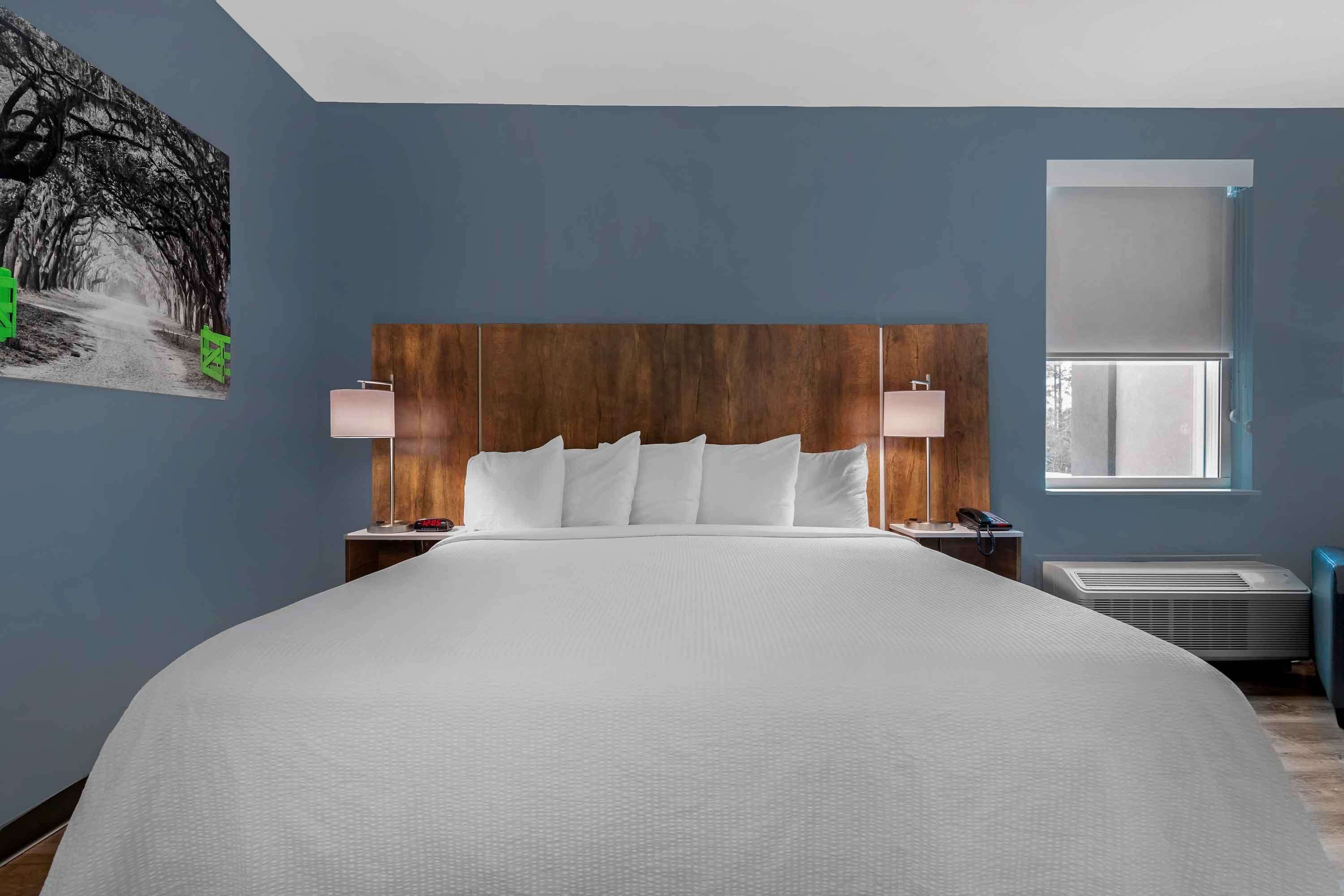 premium bedding, desk, laptop workspace, iron/ironing board