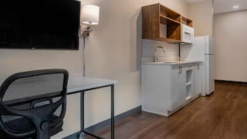 Premium bedding, desk, laptop workspace, iron/ironing board