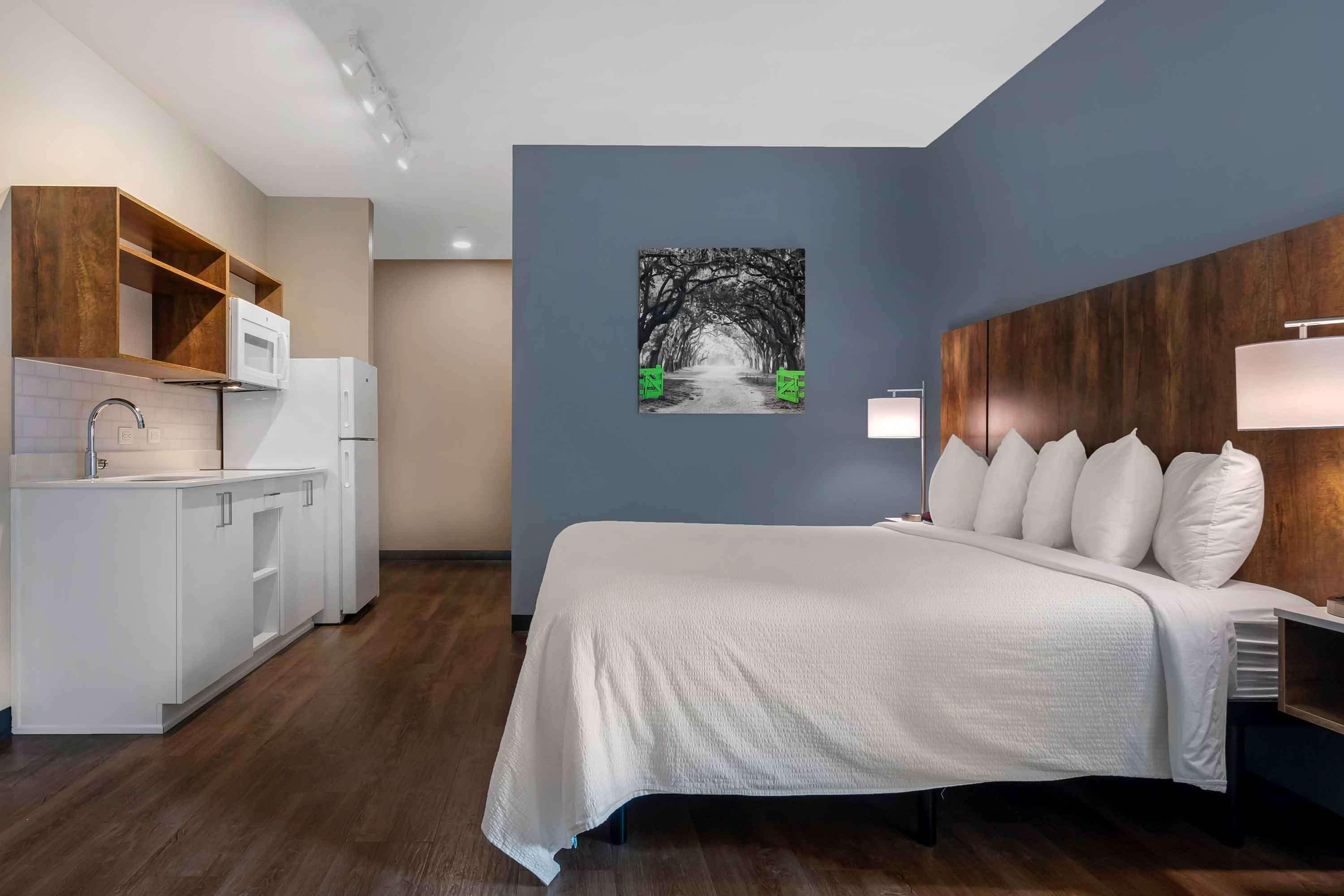 premium bedding, desk, laptop workspace, iron/ironing board