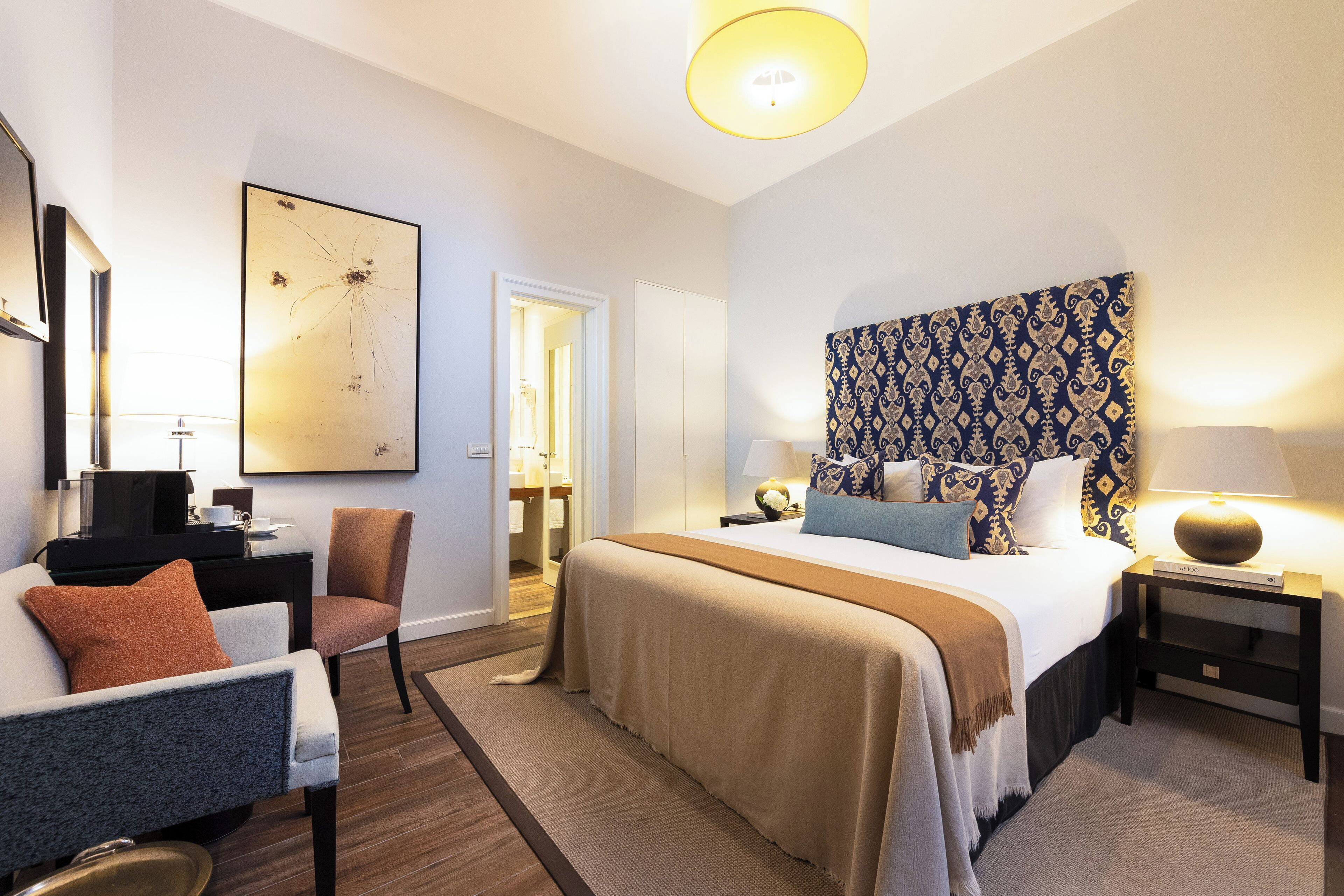 deluxe double room | 1 bedroom, minibar, in-room safe, individually decorated