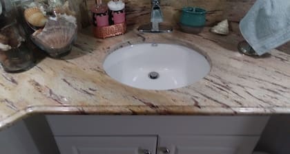 2 bedroom suite with a full kitchen, living room, and a full bathroom.