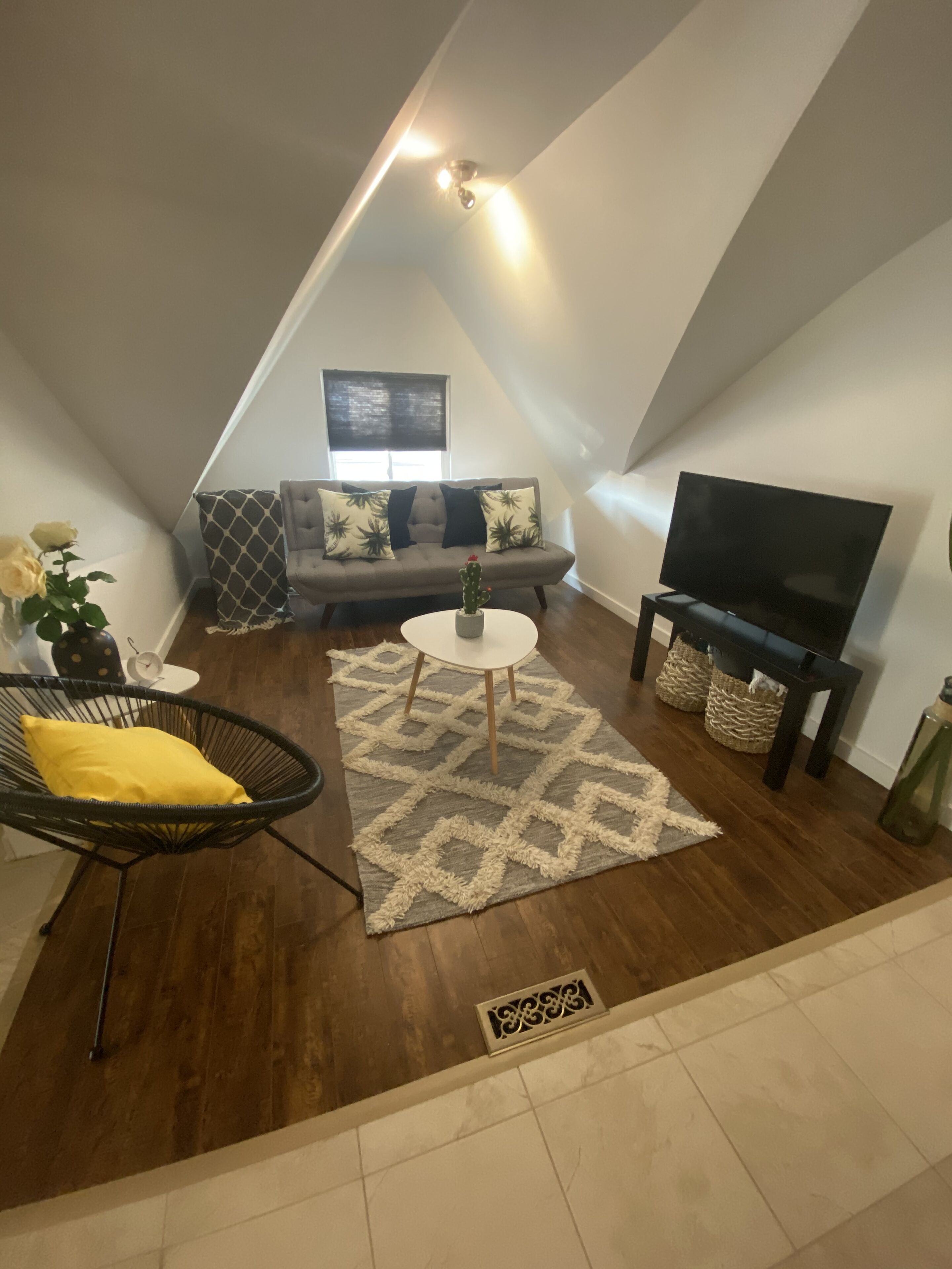 A trendy & comfy common area - television is equipped with chromecast