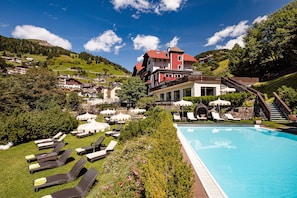 Outdoor pool, open 8:00 AM to 8:00 PM, pool umbrellas, pool loungers