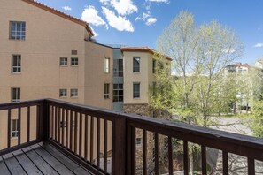 A multi-story building with a balcony.