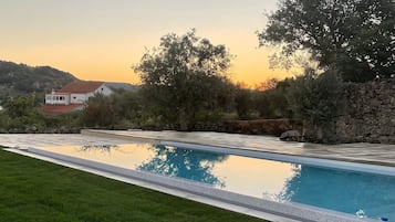 Outdoor pool, pool umbrellas, sun loungers