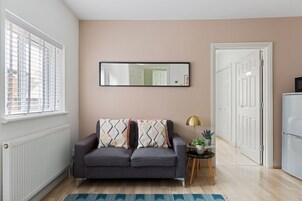 Design Apartment, 1 Double Bed, Balcony, Garden View | Living area | TV